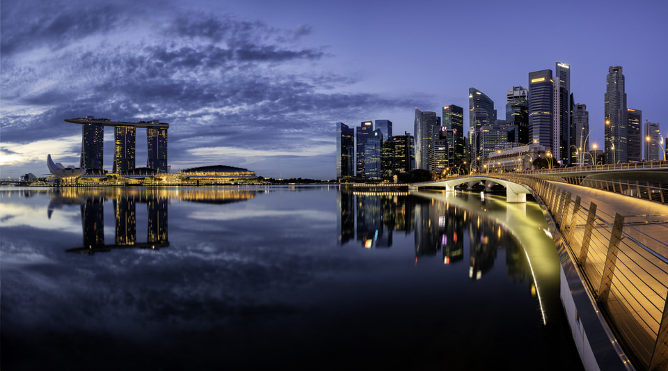 Singapore Marina Bay skyline at twilight with reflections in the water